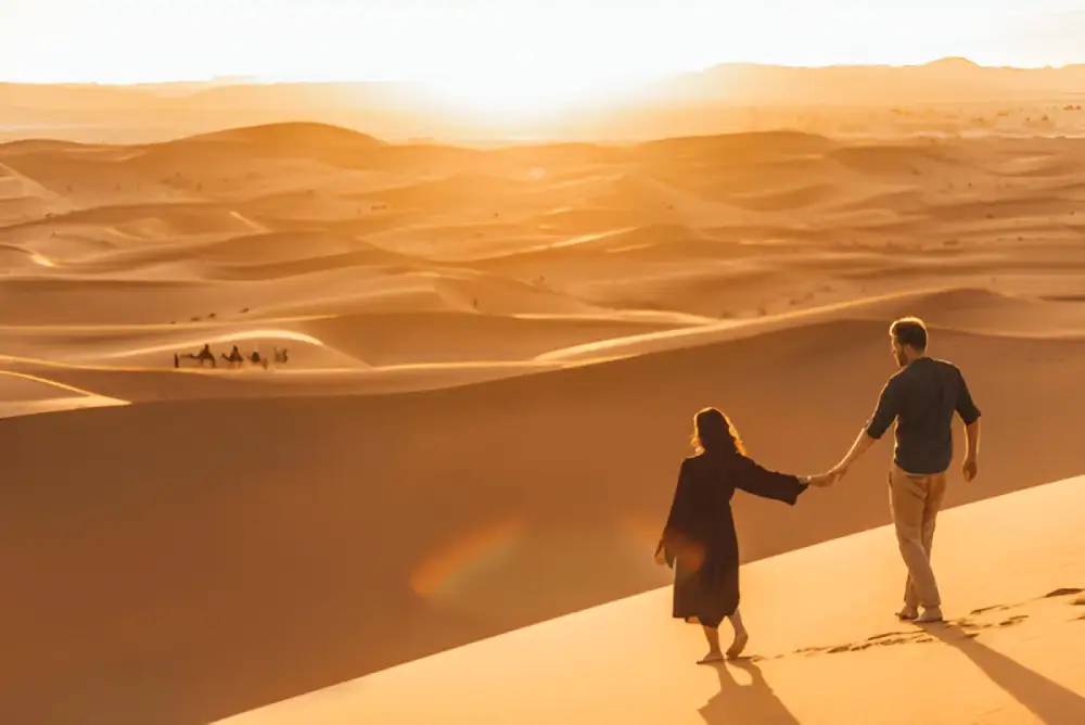 Walking in Erg Chebbi dunes on Marrakech 7-Day Tour